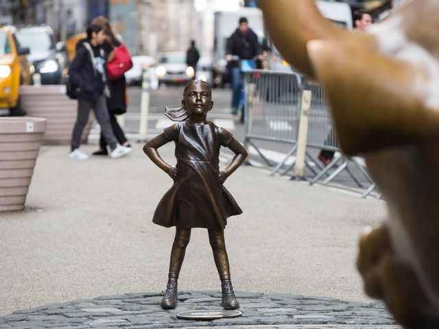 No stranger to controversy, Wall Street's "Fearless Girl" statue had what placed next to it by a frustrated artist this week?