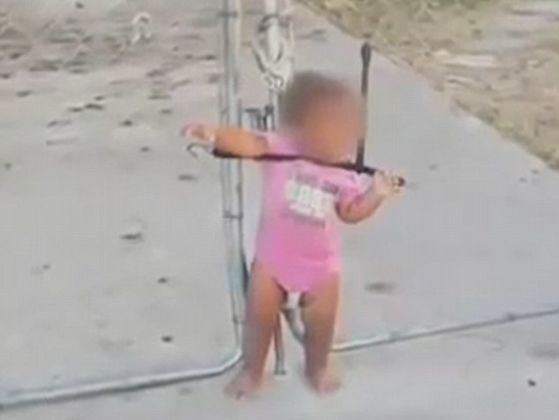 This Toddler Was Found Strapped To A Wire Fence With A Bungee Cord; See The Shocking Image