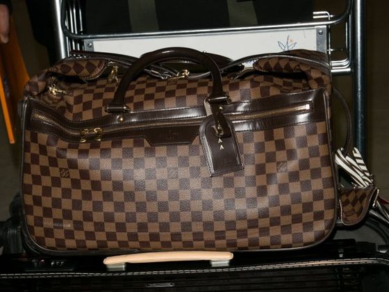 A Woman Is Demanding A Mother Replace Her $1000 Bag After Her Child Vomits On It; Do You Think She Should Pay?